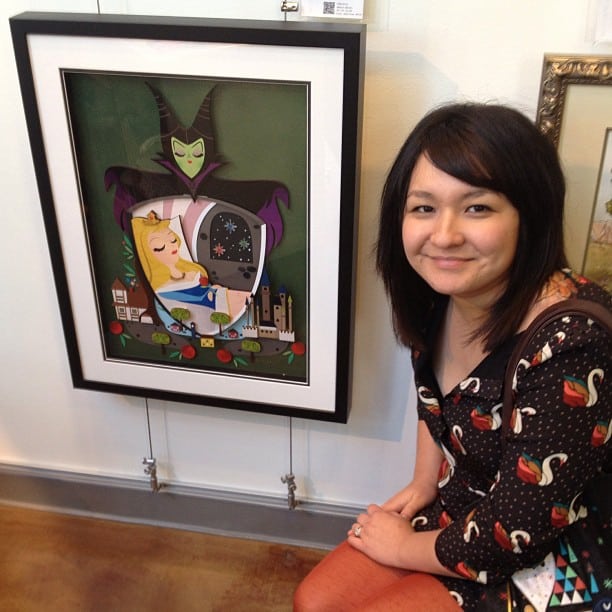 Michelle Romo poses with her 'Sleeping Beauty' piece at the 'Good Versus Evil' show at the WonderGround Gallery.