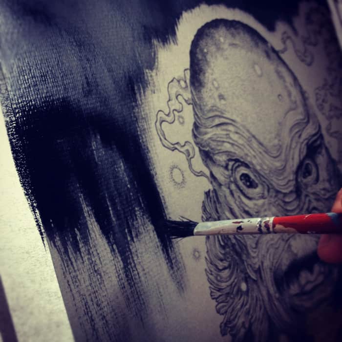 Richey Beckett working on his 'Creature' poster for Mondo's Universal Monsters show.