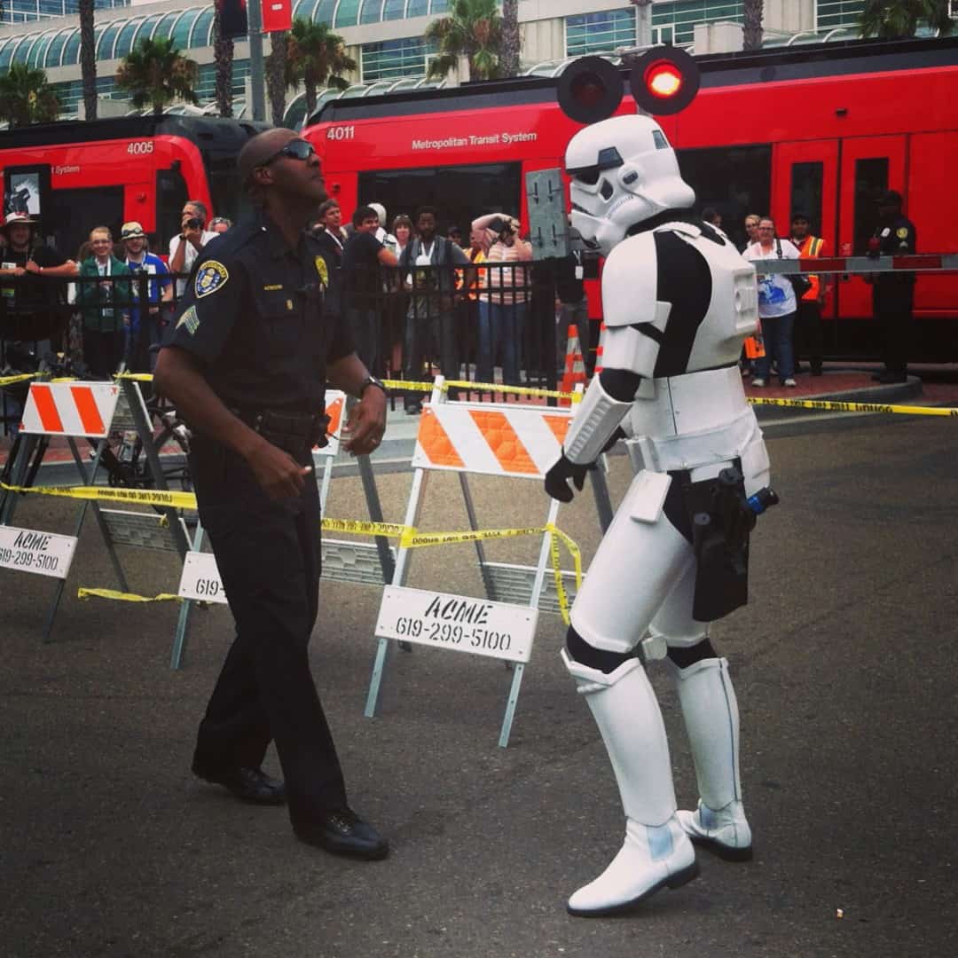 Policeman and Storm Trooper dance off.