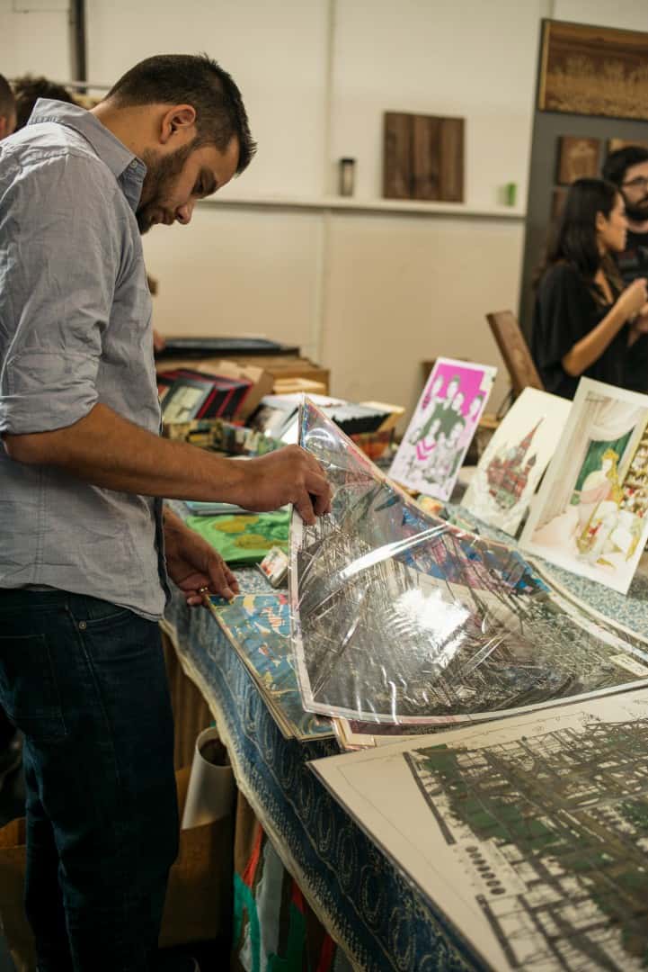 Your Humble Narrator perusing through posters from Landland | photo by Jared S. Kelly