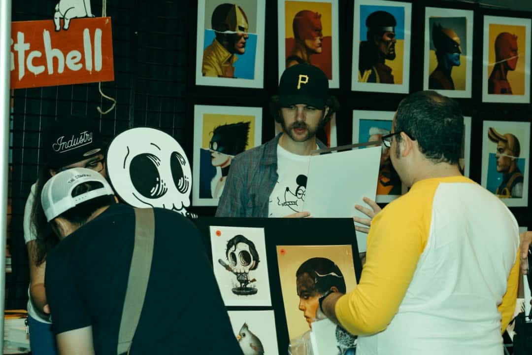 Mike Mitchell works his booth | photo by Holly Burnham