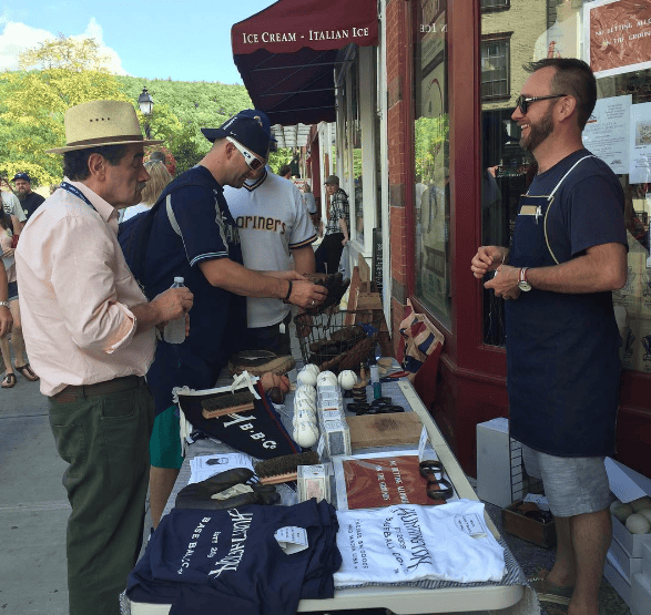 William Peebles (R) and baseball writer John Thorn (L) at the HBBC sidewalk booth during the Hall of Fame Induction Weekend in Cooperstown, NY